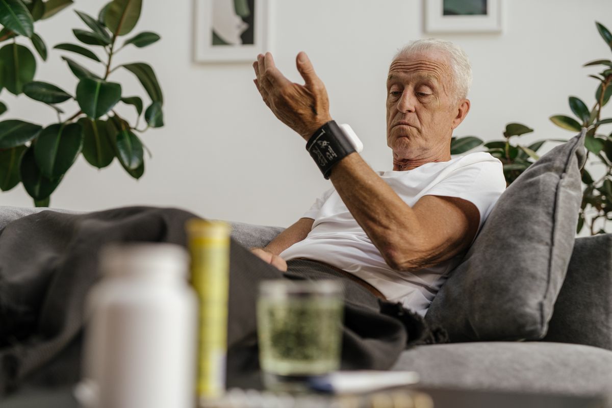 Person checking their blood pressure at home