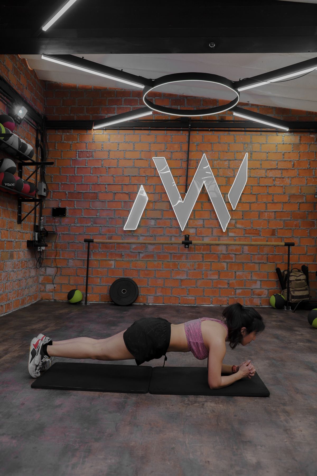 Woman holding a plank position on a yoga mat
