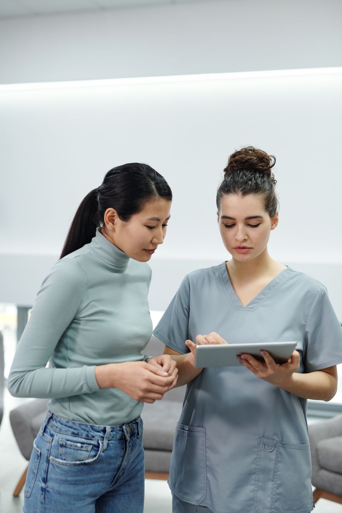 Two clinicians reviewing results together on a tablet